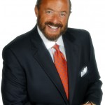 Jim Feldman in Blue Suit Orange Tie